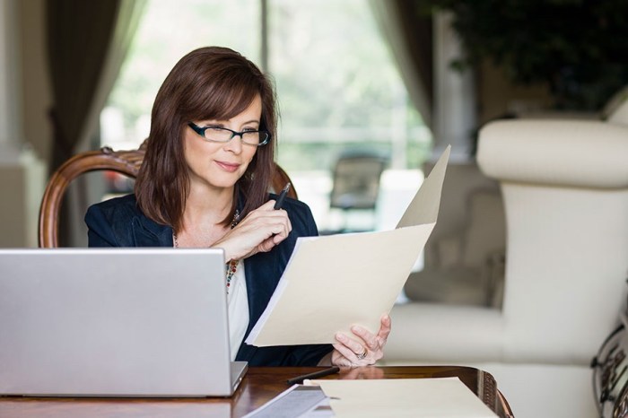 Woman reading a paper